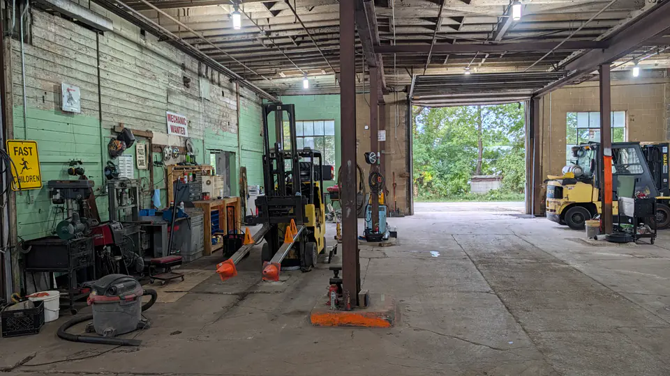 View across the Dairyland workshop toward the open bay door